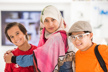 Muslim modern mother with son at home