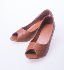 shoe. Brown colour fashion woman shoes on a background.