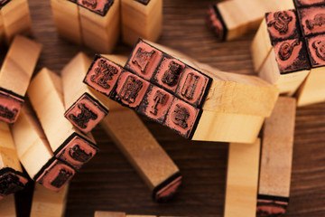 Close up of type set rubber stamps