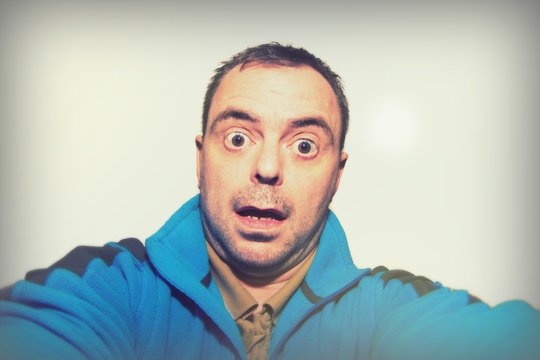 Man Talking Selfie Pulling Funny Face On White Background