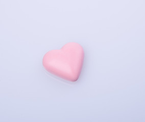 chocolate in pink colour or love shape chocolate.