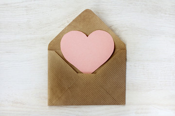 Obraz premium congratulations Happy Valentine's/ heart symbol is visible from an open, paper letter top view