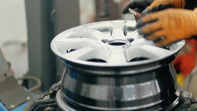 Unscrewing of screw from car wheel