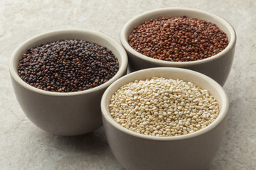 Bowls with red, white and black quinoa