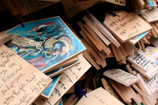 Japanese ema plaques, wooden tablets with people's wishes that are hang it on a stand outside the Hakone Shrine