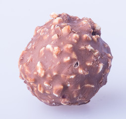 chocolate ball or chocolate bonbon on a background.