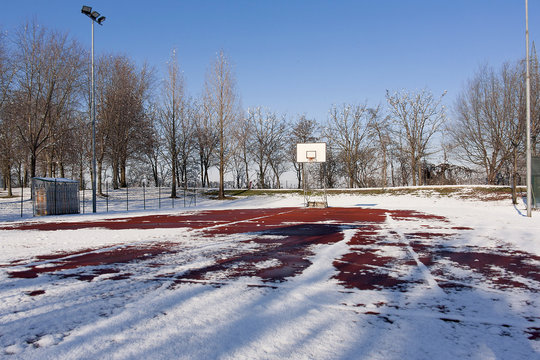 basketball backboard on blue sky outdoor in the snowy park