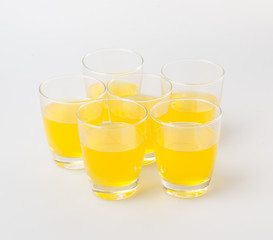Orange juice in glasses on white background.