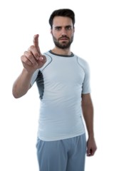 Naklejka premium Man pretending to touch an invisible screen
