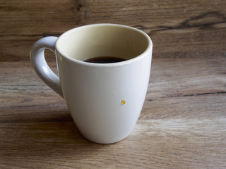 Black coffee cup on wood background