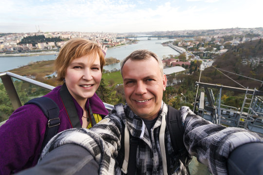 Man and Woman self Portrait at high City View Point