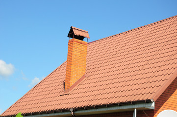 Red metal roof tiles. Metal Roof Shingles - Roofing Construction, Brick Chimney, Roofing Repair
