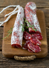 Typical traditional spanish salamis on wooden surface