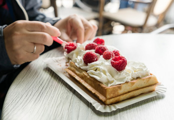 women eating belgian waffles