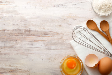 Baking ingredients flat lay on wooden background with copy space. Top view