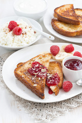 sweet breakfast - crispy toasts with raspberries, banana and jam