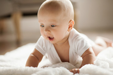 Portrait of small surprised baby.