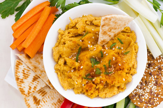 traditional Arabic sauce hummus with fresh vegetables 