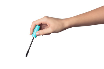 Close up of woman's hand holding an eyelash brush