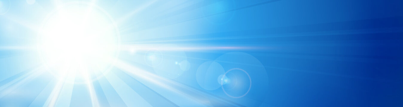 Blue sky with sun and lens flare panorama, header, banner