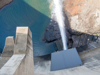 Top view of release of water at impressive Katse Dam hydroelectric power plant in Lesotho, Africa