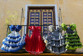 Traditional flamenco dresses at a house in Malaga, Spain - obrazy, fototapety, plakaty