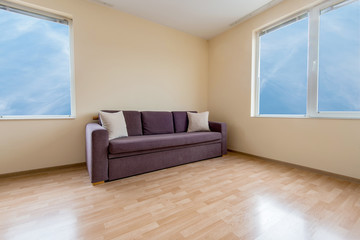 living room with a sofa, windows and curtains - copy space