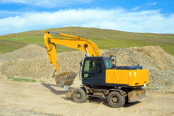Wheel excavator on the construction of a new road in the steppe zone 