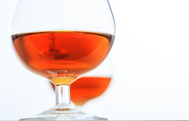 Two cognac glasses on white background