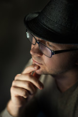 Fototapeta na wymiar handsome man in hat and glasses posing