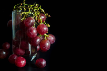 Red grape on glass