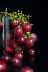 Red grape on glass