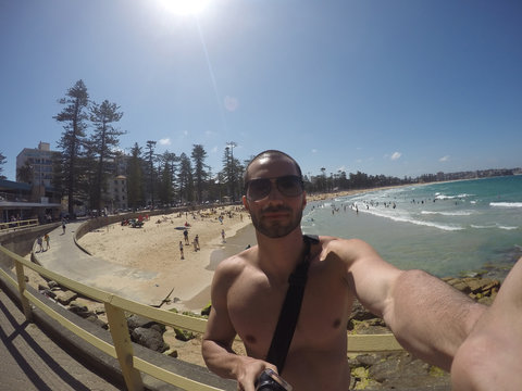 Man taking a selfie in Manly Beach, Sydney, Australia