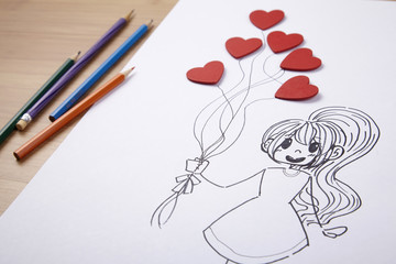 girl holding heart shaped ballon