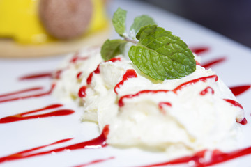 white cakes and mint leaves  selective focus of mint leaves macr