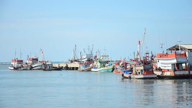 Fishing boat and ship floating in the sea for waiting fishing in night time at Ang Sila Fishing village and seafood Market on January 2, 2017 in Chonburi, Thailand