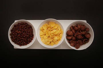 Bowls of various cereals - top view