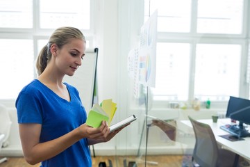 Female graphic designer using digital tablet