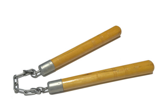 Wooden nunchaku on a chain isolated on white   background