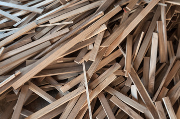 Pile of wood logs for build Furniture production,sew natural wood scraps, ready to recycle and...