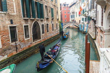 Fototapeta na wymiar Famous Gondola boat on the canal at Venice.
