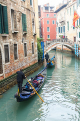 Fototapeta na wymiar Famous Gondola boat on the canal at Venice.