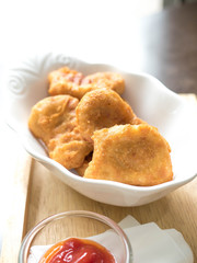 chicken nugget and delicious menu on beautiful plate in a restaurant.