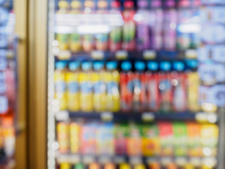 supermarket refrigerator shelves with beverage products