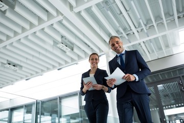 business colleagues standing with tablet 