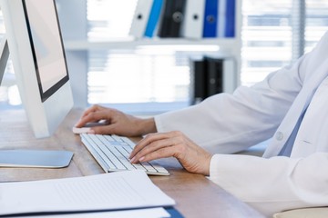 Female doctor working on computer