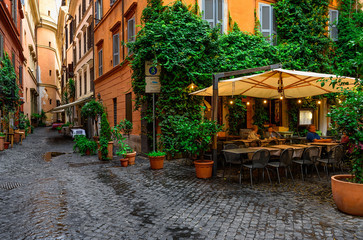 Obraz na płótnie Canvas View of old cozy street in Rome, Italy