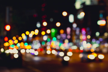 Blurred image of city at night. Defocused, blurred urban abstract traffic background.