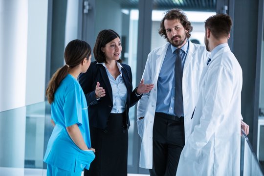 Businesswoman interacting with doctors