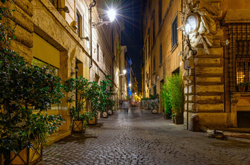 Night view of old cozy street in Rome, Italy